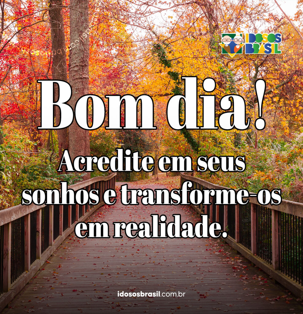 Mensagem motivacional de bom dia com a frase 'Acredite em seus sonhos e transforme-os em realidade' sobre uma paisagem de outono