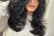 Mulher com corte Marquise Layers exibindo camadas volumosas e elegantes.