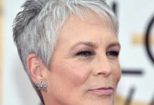 Mulher madura com corte de cabelo pixie grisalho, estilizado e moderno.