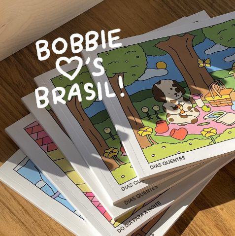 Imagem de cartões ilustrados de Bobbie Goods com design colorido e um cachorro com óculos de sol, representando o tema 'Dias Quentes'.