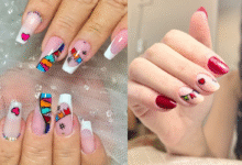Unhas decoradas com tema junino, corações, bandeirinhas e cores vibrantes