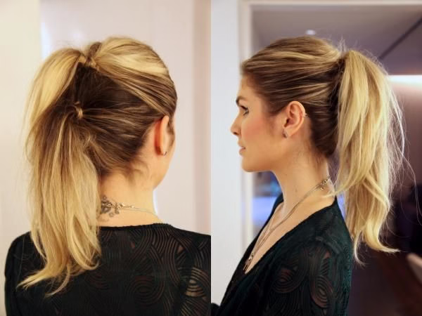 Mulher com cabelo preso em dois rabos de cavalo, um estilo moderno e volumoso.
