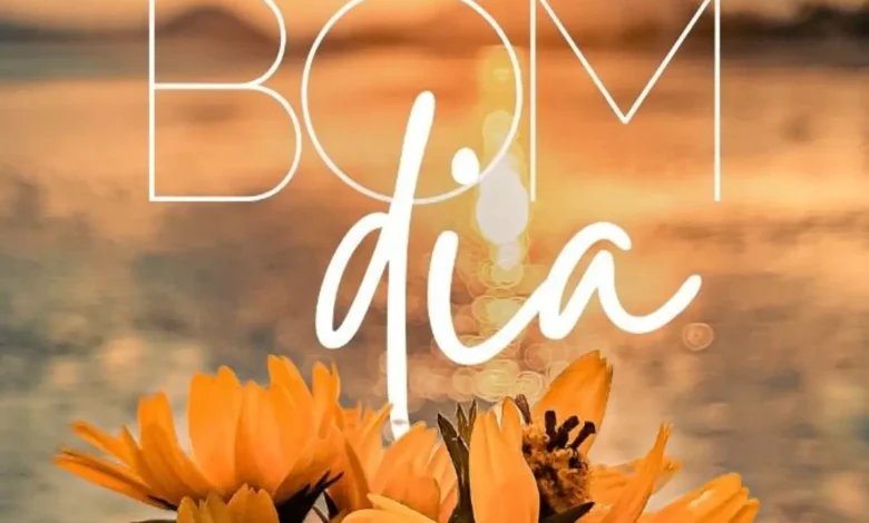 Mensagem positiva de bom dia com flores e o nascer do sol, para alegrar o início do dia.