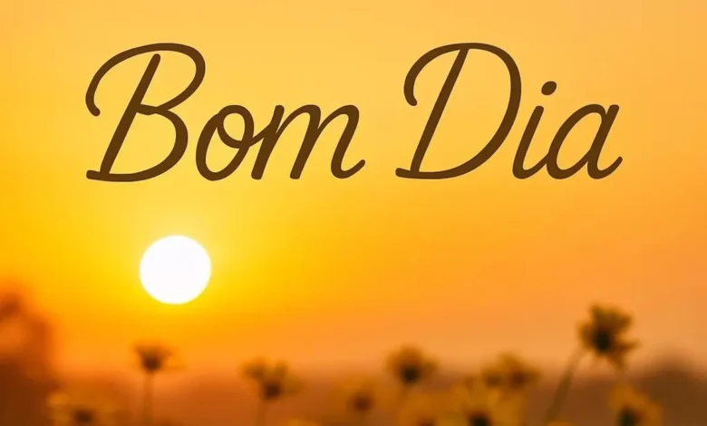 Imagem de um lindo amanhecer com flores e o texto 'Bom Dia' em destaque.