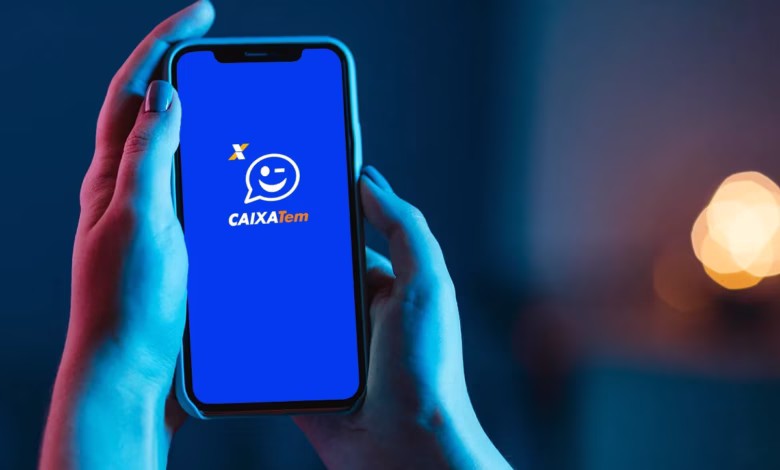 Tela do aplicativo Caixa Tem com logo em azul, indicando o processo de manutenção. A tela mostra o ícone do aplicativo com a marca Caixa Tem.