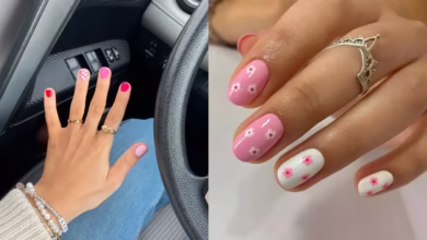 Unhas curtas decoradas com tons de rosa e detalhes florais.