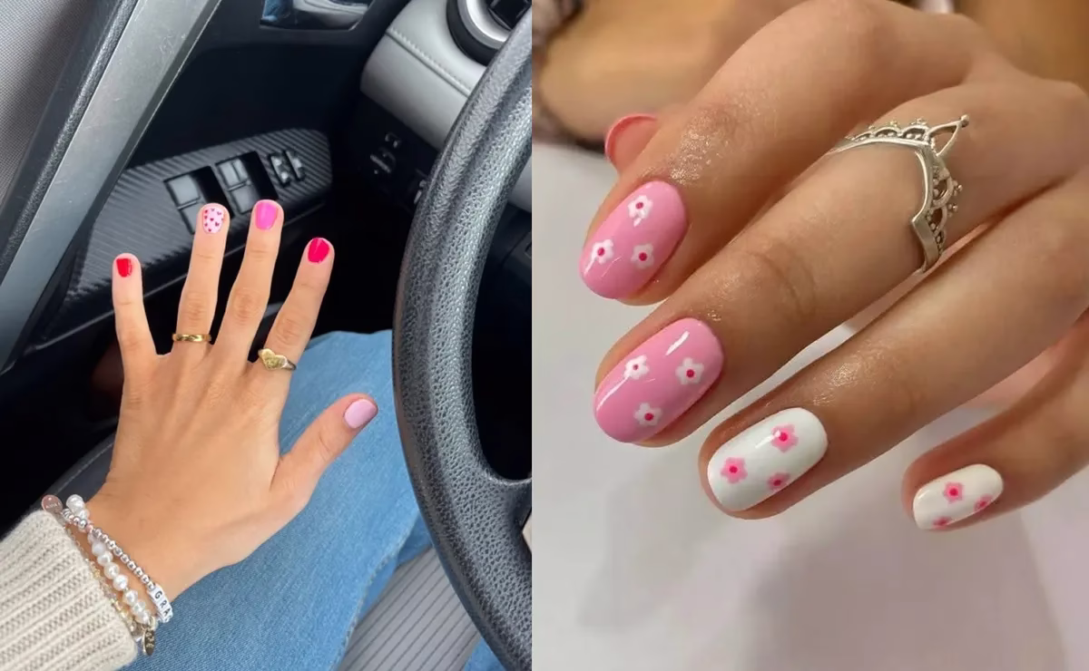 Unhas curtas decoradas com tons de rosa e detalhes florais.
