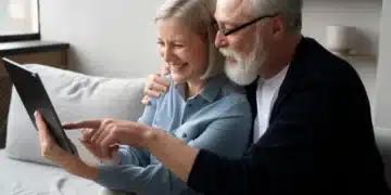 Casal de idosos explorando a tecnologia juntos, usando uma tablet para aprender com a inteligência artificial."