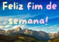 Imagem com paisagem montanhosa e frase 'Feliz fim de semana!' em estilo colorido e alegre.