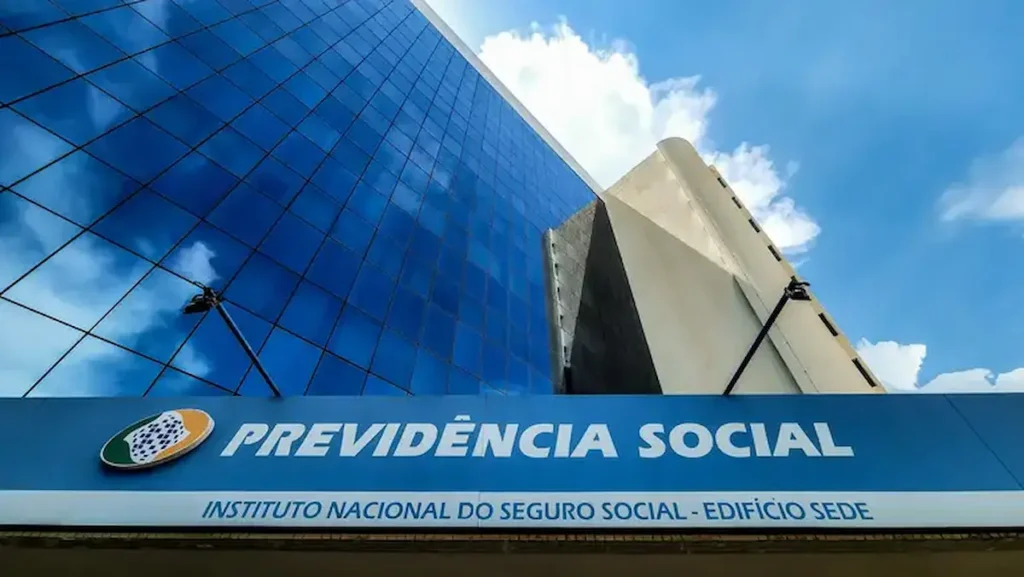 Previsões de pagamentos do INSS 2026 Edifício sede do INSS com fachada azul, relacionado ao calendário de pagamentos do INSS em 2026.