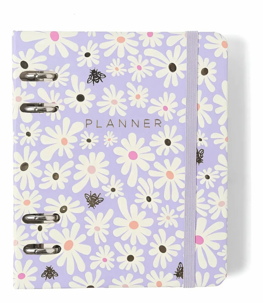 Planner Argolado Cicero A6 Planner Argolado Cicero A6 com capa lilás com flores e elástico roxo.