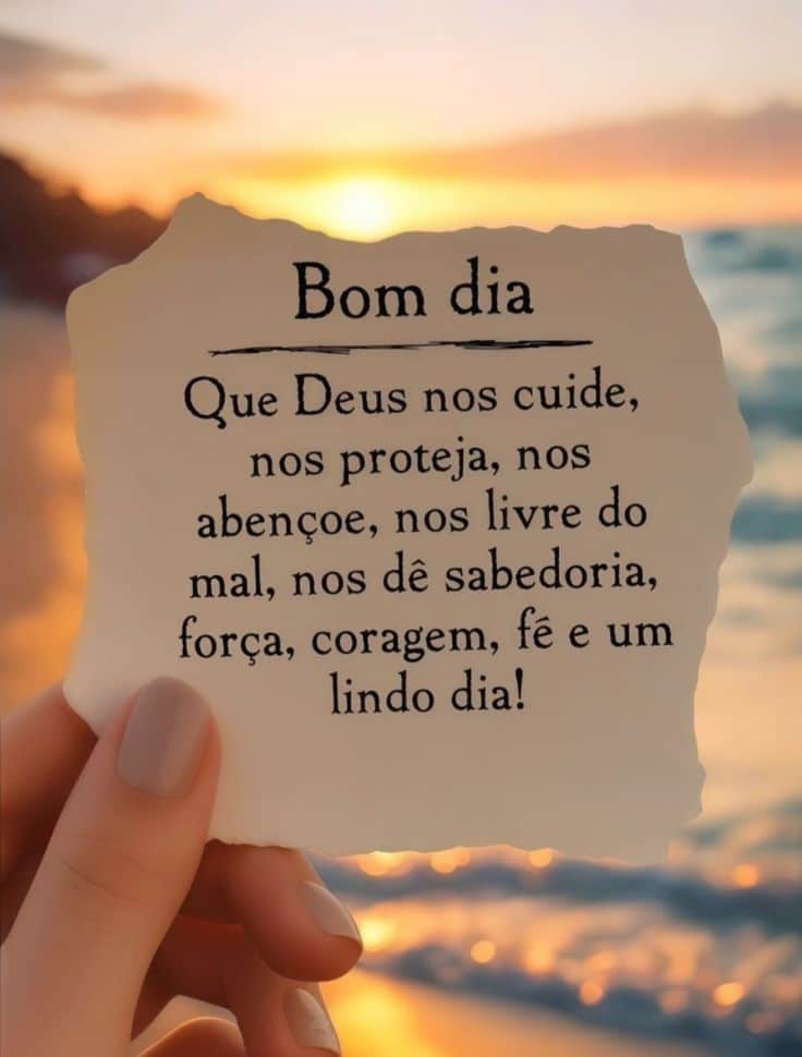 Papel com mensagem religiosa desejando bom dia e proteção, com pôr do sol ao fundo
